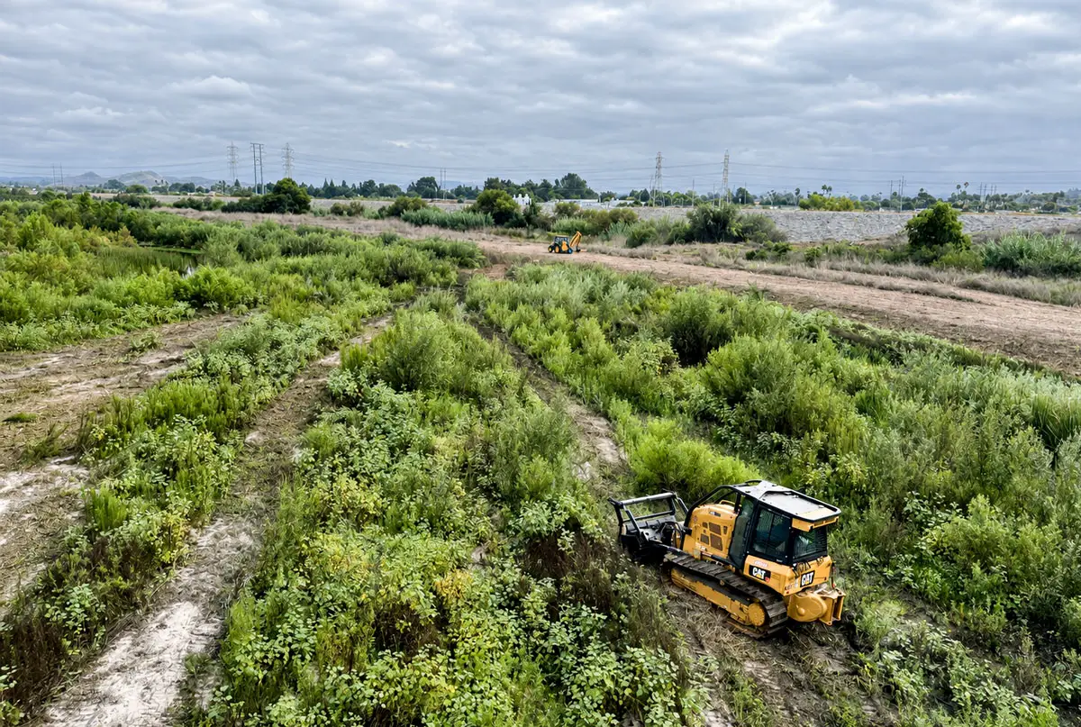 City crews clear vegetation along the San Luis Rey River last year. Courtesy photo/City of Oceanside