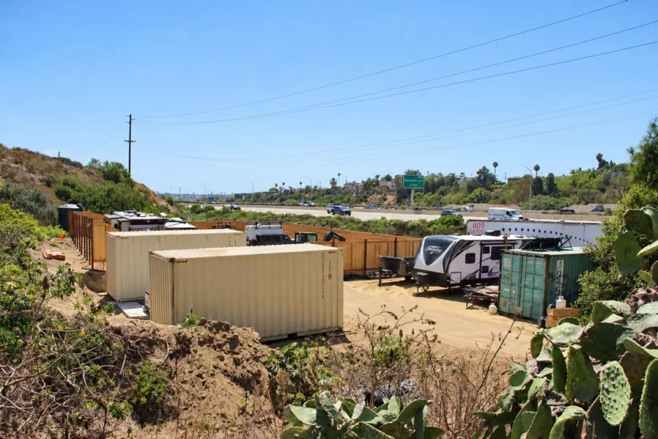 Shipping containers stand on a parcel zoned Rural Residential 2, which allows agricultural uses and low-density, single-family detached housing. Photo by Jordan P. Ingram