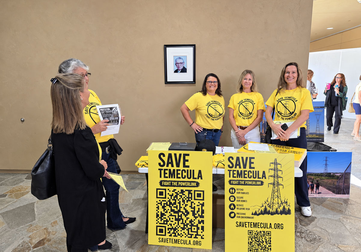 Residents from communities along the proposed Golden Pacific Powerlink route gather inside the San Marcos City Council chambers to voice their opposition during Thursday’s public hearing. Photo by Jim Trageser