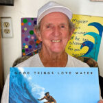 Skip Frye holds a copy of Chris Ahrens’ new book, “Good Things Love Water.” Photo by Chris Ahrens