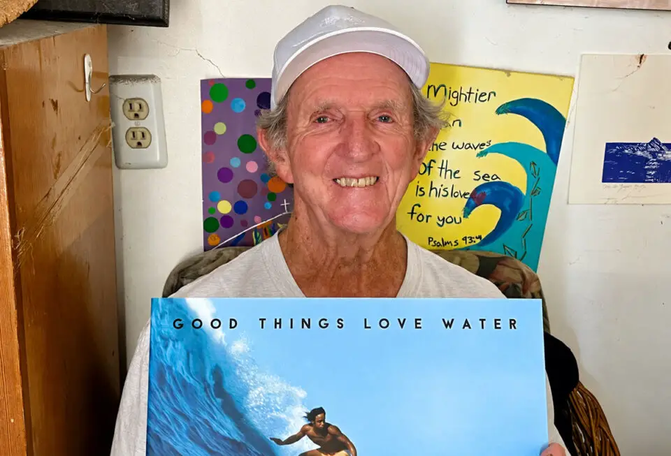 Skip Frye holds a copy of Chris Ahrens’ new book, “Good Things Love Water.” Photo by Chris Ahrens