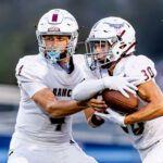 Longhorns quarterback Van Piercy hands the ball to running back Ean Perfect earlier this season. Photo by Michael Manzano