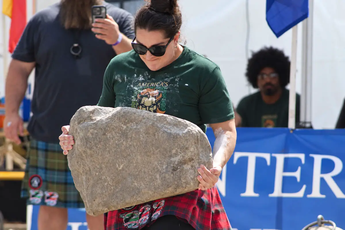 A woman lifts a 175-pound stone on Sept. 20 at the Vista Viking Festival, the primary qualifier for America's Strongest Stone Lifter. 