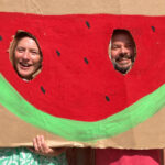 Candy Cahill, director of Carlsbad Village Yoga, celebrates with Kekoa Eade at the Carlsbad Watermelon Festival. Photo by Jano Nightingale