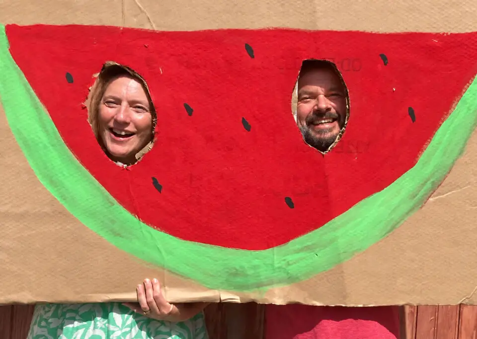 Candy Cahill, director of Carlsbad Village Yoga, celebrates with Kekoa Eade at the Carlsbad Watermelon Festival. Photo by Jano Nightingale