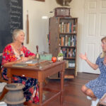 Encinitas Historical Society president Carolyn Cope, left, and Encinitas Chamber CEO Carol Knight at the 1883 Schoolhouse, the oldest standing building in Encinitas. Courtesy photo