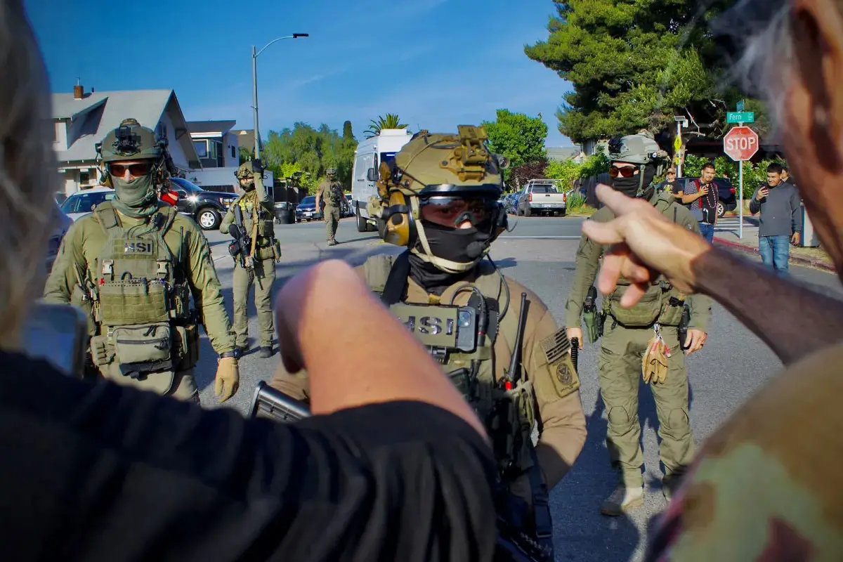 Neighbors confront Immigration and Customs Enforcement’s Special Response Team officers following an immigration raid at the Italian restaurant Buono Forchetta in San Diego on May 30, 2025. Photo courtesy of Pedro Rios