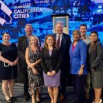 Council Member Teresa Acosta, center in purple dress, at League of California Cities annual convention. Photo courtesy of City of Carlsbad