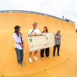 Jess Robledo and Amelia Brodka of Exposure Skate present a check to John Van Cleef of the Community Resource Center during the 2025 Exposure Skate event. Photo by Hailey Critterdon