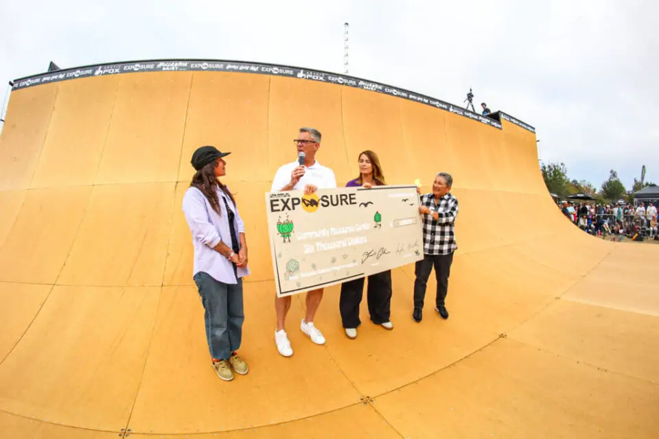 Jess Robledo and Amelia Brodka of Exposure Skate present a check to John Van Cleef of the Community Resource Center during the 2025 Exposure Skate event. Photo by Hailey Critterdon