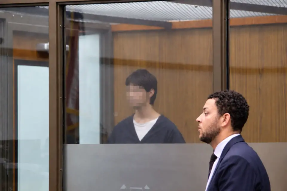 Jonathan William Badillo, left, appears behind glass with his attorney during an Oct. 7 hearing at the Vista Courthouse.