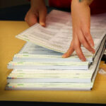 A worker handles ballots at the San Diego County Registrar of Voters. Courtesy photo/County of San Diego
