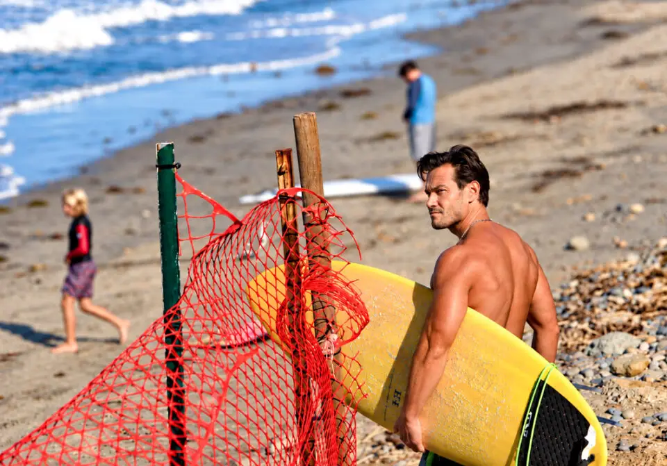 A surfer makes his way to the shoreline on Oct. 15 at Beacon's Beach in Leucadia. Photo by Jordan P. Ingram