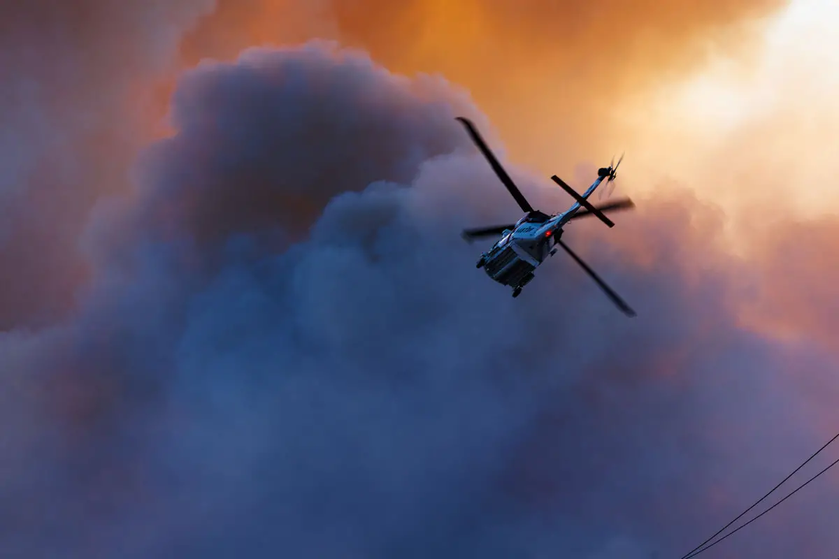 A helicopter flies above the Henderson Fire at Camp Pendleton. Photo by Sgt. Haley Fourmet Gustavsen