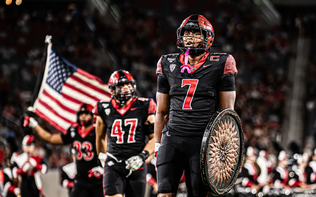 San Diego State’s Lucky Sutton recorded his seventh career 100-yard rushing game in Saturday’s 26-23 win over Fresno State. The Cathedral Catholic graduate finished with 119 yards on 18 carries as the Aztecs snapped a three-game losing streak. Photo by Isaac Angel