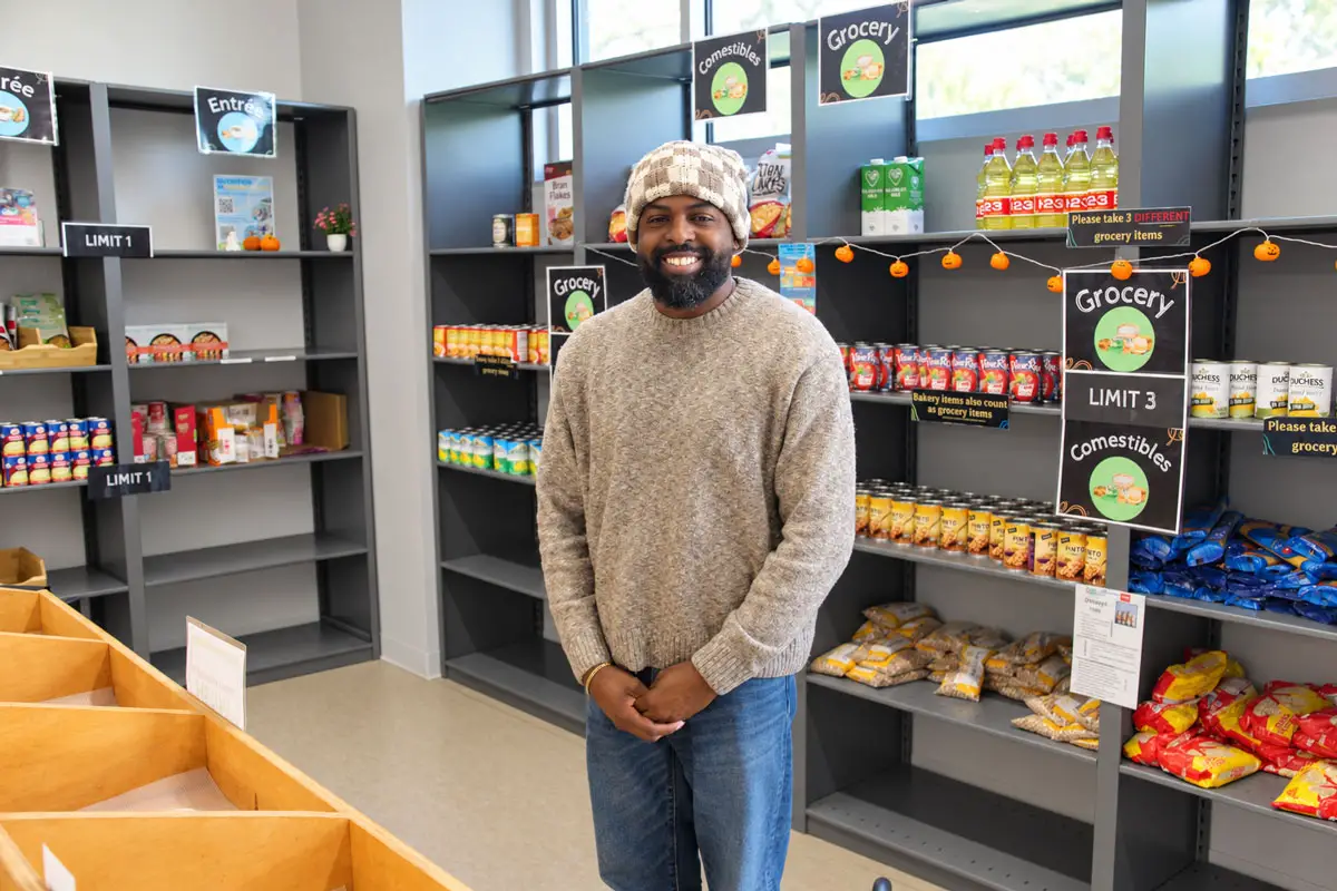 Devon Boone, director of Campus Assessment, Resources & Education at MiraCosta College, stands in the campus pantry. Photo by Jim Trageser