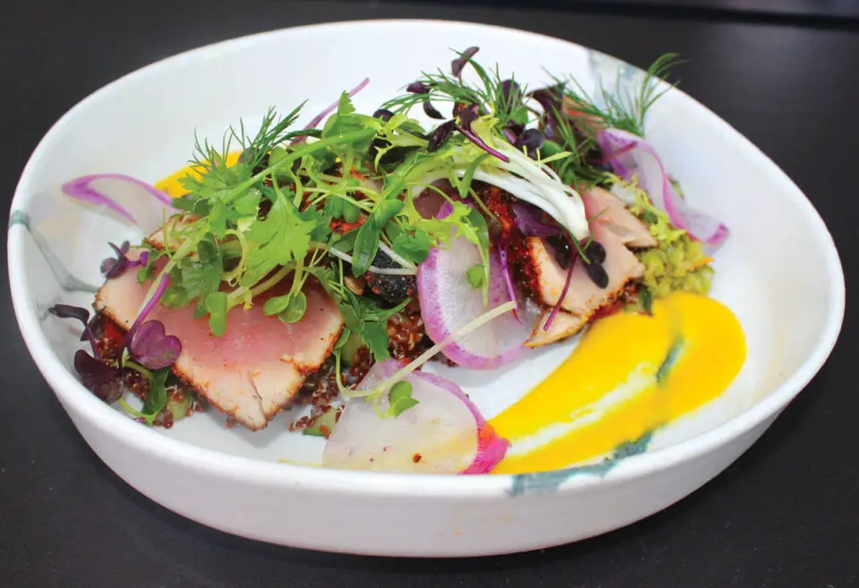 Blackened-Crusted Ahi Tuna at Mia's in Solana Beach, served with Mediterranean quinoa salad, Castelvetrano olive tapenade, ninja radishes and ginger-coconut emulsion. Photo by Rico Cassoni