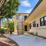 The existing apartment complex and commercial structures along Roosevelt Street in Carlsbad Village would be demolished and replaced with a four-story mixed-use building. Photo by Jordan P. Ingram