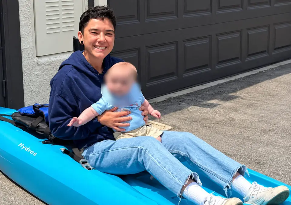 Samantha Youngs, 27, pictured with a child in a kayak, was reported missing Tuesday morning after her vehicle was found at the Torrey Pines Gliderport in La Jolla. Courtesy photo/USCG