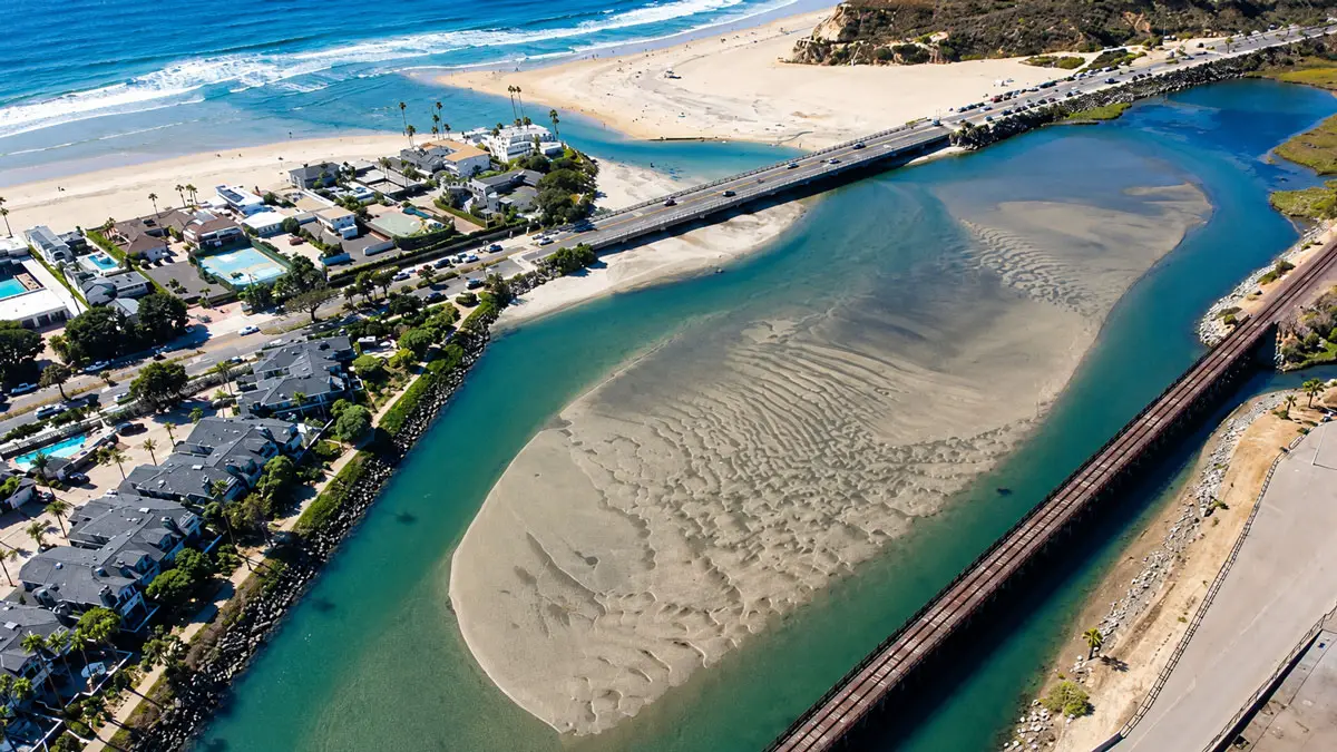 An aerial view looking west toward the Pacific Ocean shows sand buildup at the San Dieguito Lagoon inlet in Del Mar. Encinitas residents are proposing to recycle sand dredged from the inlet to replenish eroding beaches in northern Encinitas. Courtesy photo/City of Del Mar