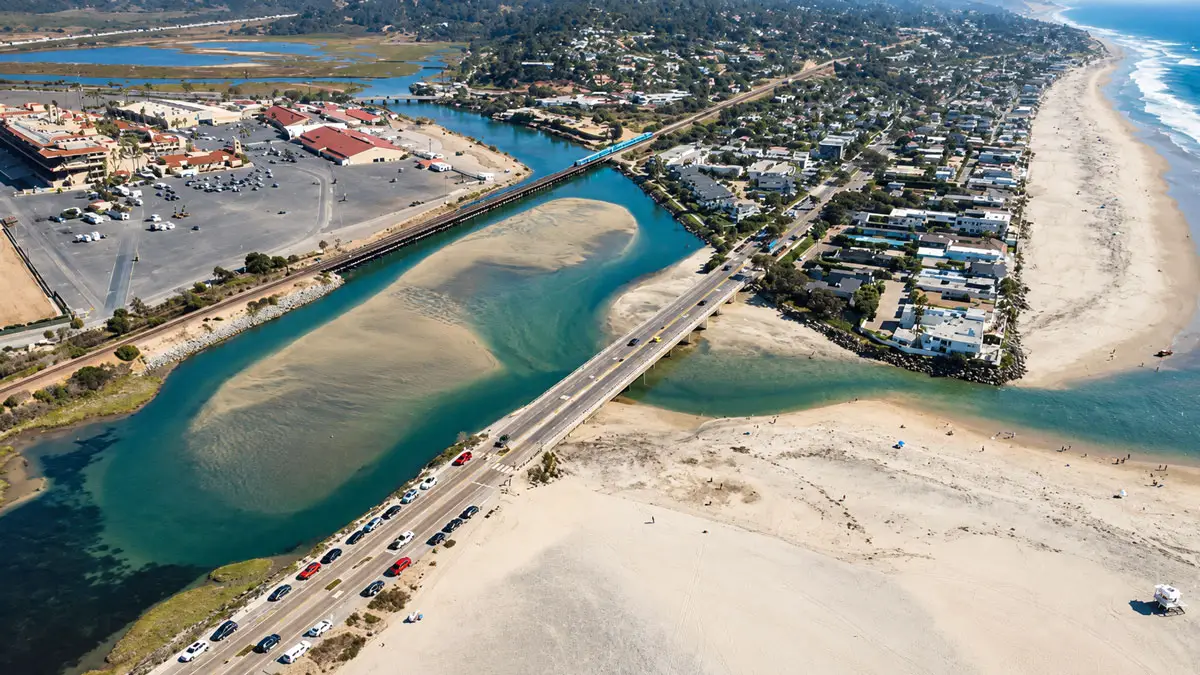 An aerial view looking west toward the Pacific Ocean shows sand buildup at the San Dieguito Lagoon inlet in Del Mar. Encinitas residents are proposing to recycle sand dredged from the inlet to replenish eroding beaches in northern Encinitas. Courtesy photo/City of Del Mar