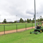 A city employee mows the grass at a San Marcos sports field. Courtesy photo