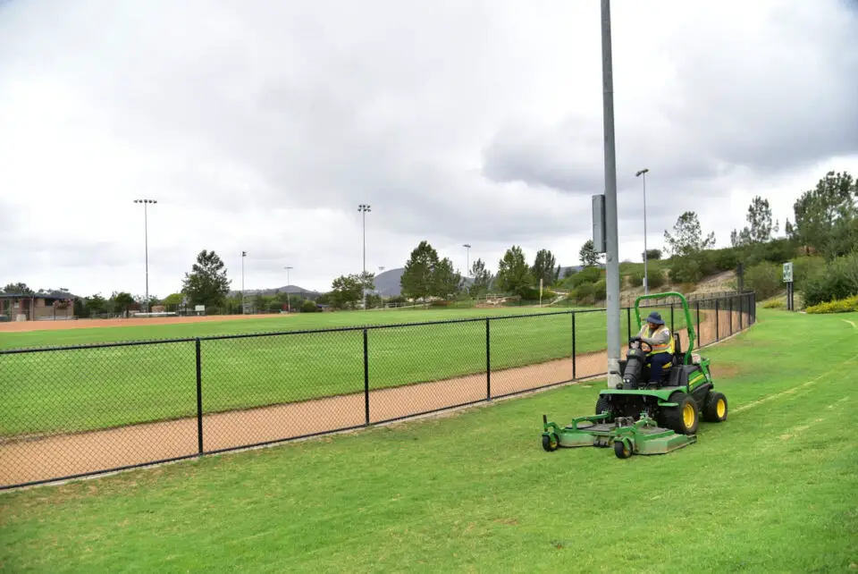 A city employee mows the grass at a San Marcos sports field. Courtesy photo