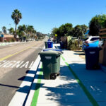 Trash cans on the sidewalk along Santa Fe Drive in Encinitas. Photo by Bill Rodenwald