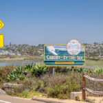 Writing A sign marks the Solana Beach-Encinitas border along Coast Highway 101, where Encinitas officials have recommended roadway changes that include a pedestrian crossing signal. Photo by Mark Krancer