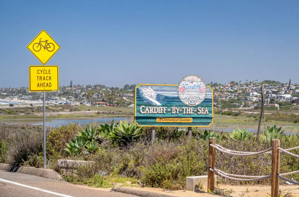 Writing A sign marks the Solana Beach-Encinitas border along Coast Highway 101, where Encinitas officials have recommended roadway changes that include a pedestrian crossing signal. Photo by Mark Krancer