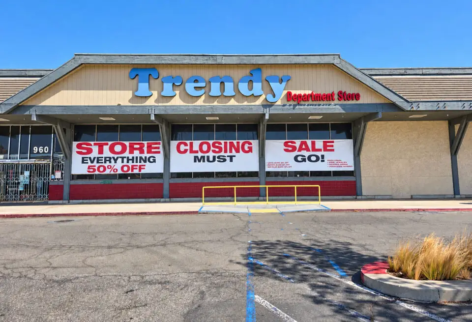 Large vinyl signs announce the closing of Trendy Department Store in Vista, which will remain open through the end of the year. Photo by Jim Trageser