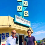Kamil Mansoor, left, who bought the store in 1992, and longtime employee Tony stand outside Leucadia Liquor on N. Coast Highway 101, which is closing at the end of the month after six decades. Photo by David Boylan