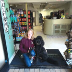 Earthwise Pet owner Leslie Hicks, a certified pet nutritionist, and her dog Duke at the store in Cardiff. Courtesy photo