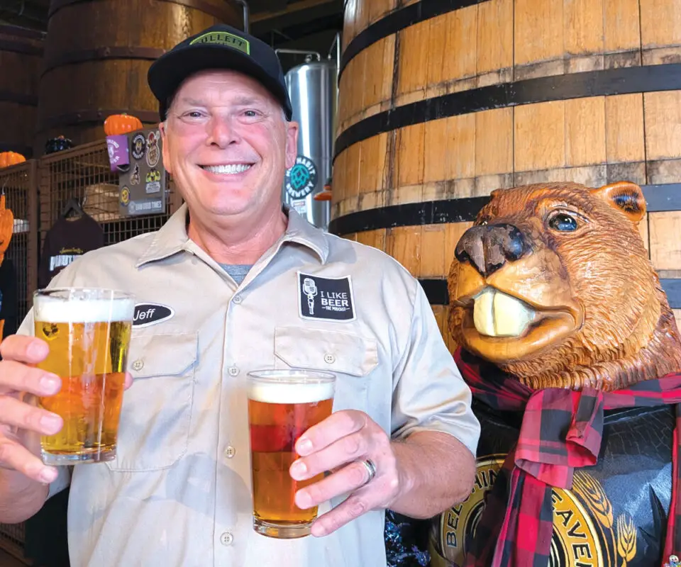 The author at Belching Beaver Pub 980 in Vista, holding examples of a Festbier, left, and a Märzen. Courtesy photo