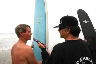 Two surfers with surfboards