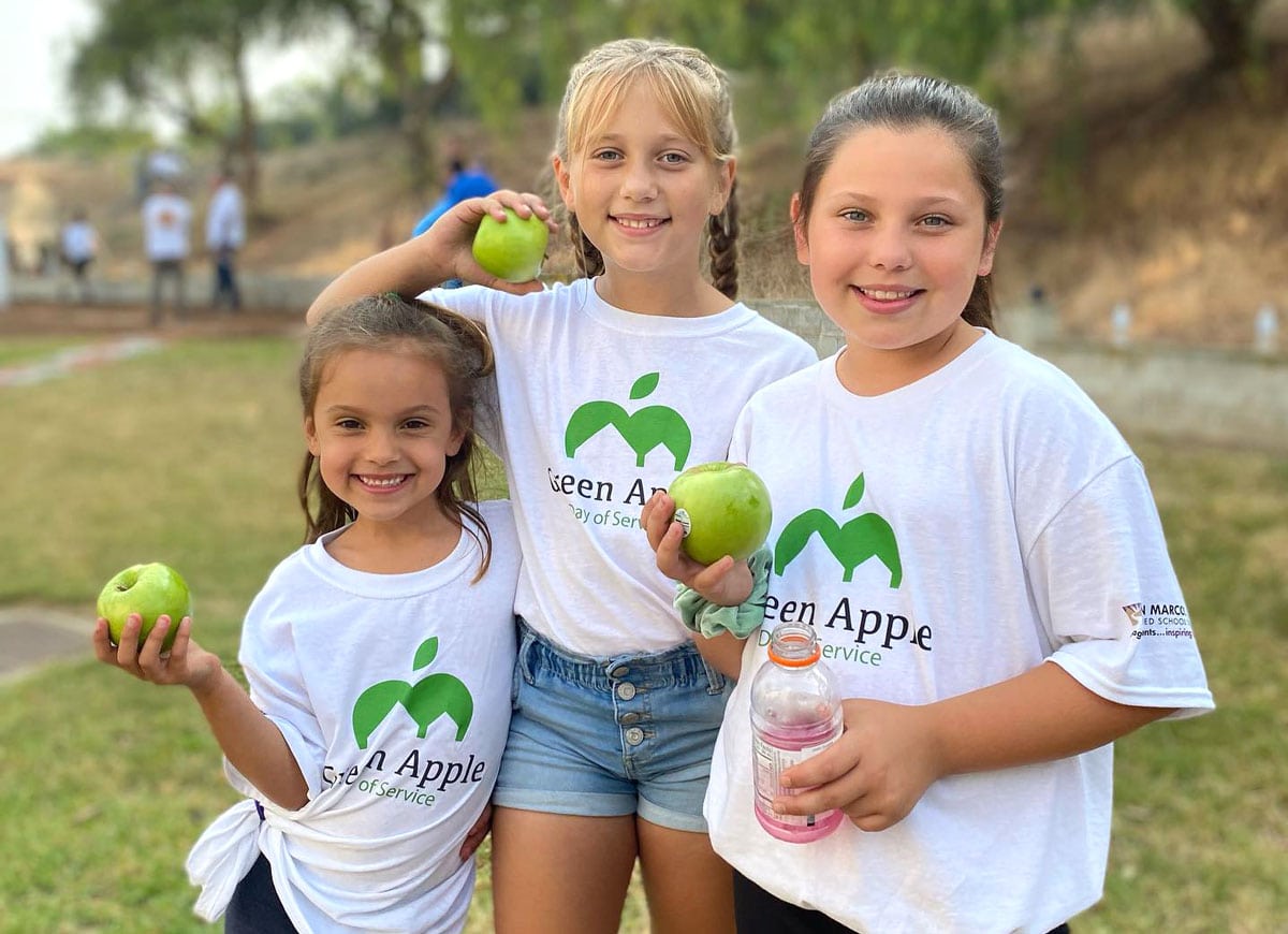 A trio of young volunteers, left to right, Emma Frandsen, Callie Marty and Kinleigh Frandsen, took part in the Green Apple Day of Service this past Saturday at Knob Hill Elementary School in San Marcos. Courtesy photo