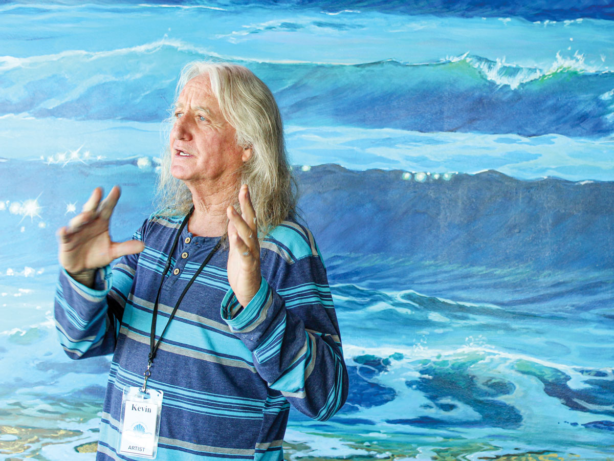 Local artist Kevin Anderson recently completed his mural at the Encinitas Library. The project, inspired by the beauty of Moonlight Beach, was commissioned by the Friends of the Encinitas Library. Photo by Bill Slane