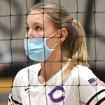 Cayla Payne, a junior at Carlsbad High School, waits at the net during a CIF Division II State Championship game against Redwood on Saturday night in Orange. Photo by Jann Hendry