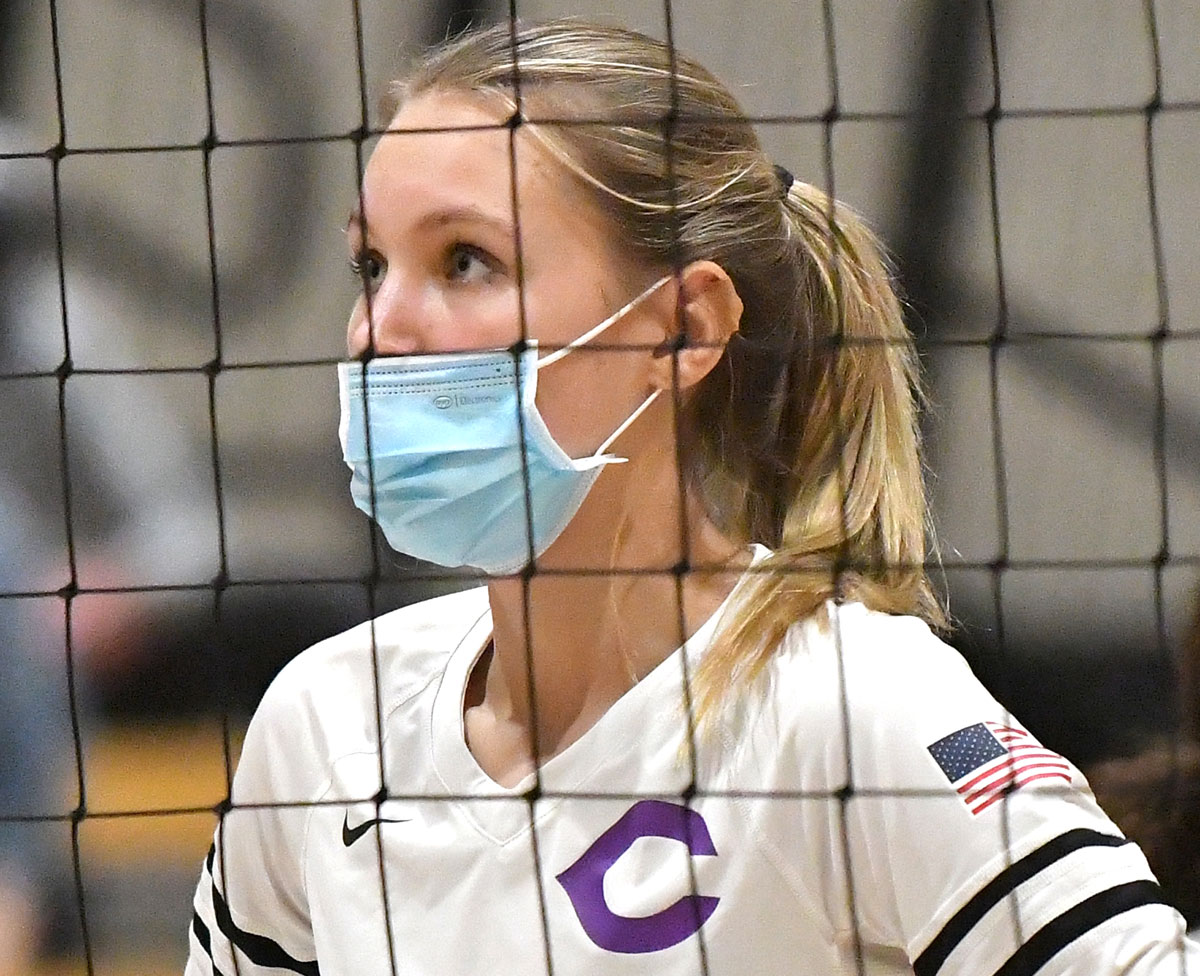 Cayla Payne, a junior at Carlsbad High School, waits at the net during a CIF Division II State Championship game against Redwood on Saturday night in Orange. Photo by Jann Hendry