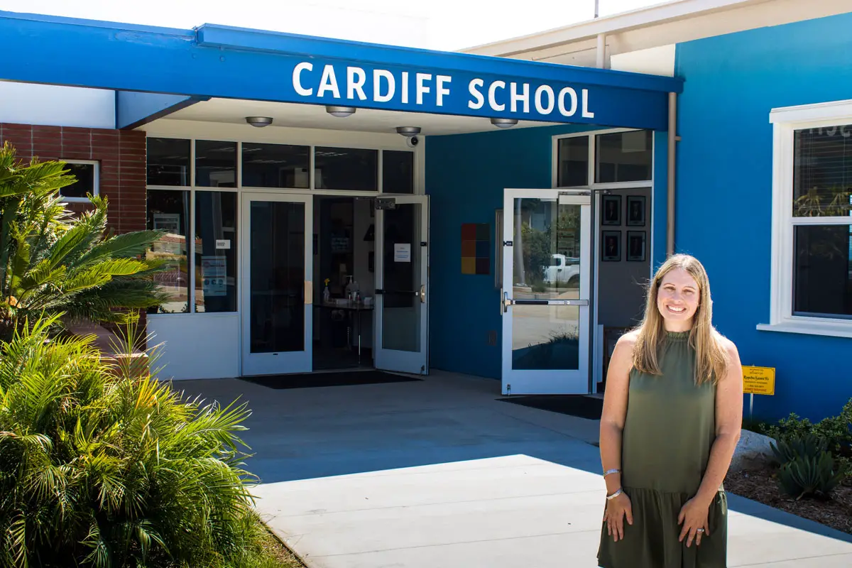 Michell Giroux stands in front of the Cardiff School a week before welcoming students back to the classroom from summer break. Photo by Bill Slane