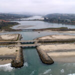 Aerial view of Batiquitos Lagoon in Carlsbad. One element of the city’s Local Coastal Program Land Use Plan update is how it tackles threats to infrastructure (roads, bridges) and natural landmarks (lagoons and blufftops). Courtesy photo